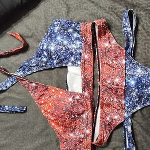 Crisscross neck ties at neck, removable padding, bottoms have two side straps